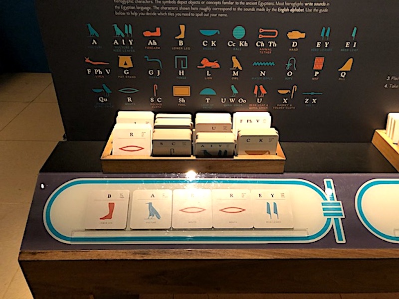 Using hieroglyphic cards to create my name at the Queens of Egypt exhibition at the National Geographic Museum