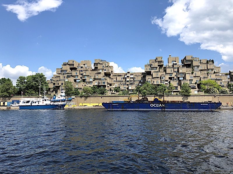 The Habitat 67 housing complex facing the Old Port Montreal basin near the St. Lawrence River