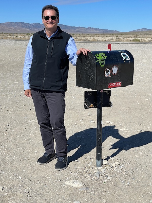 Barry Kramer standing next to the black mailbox