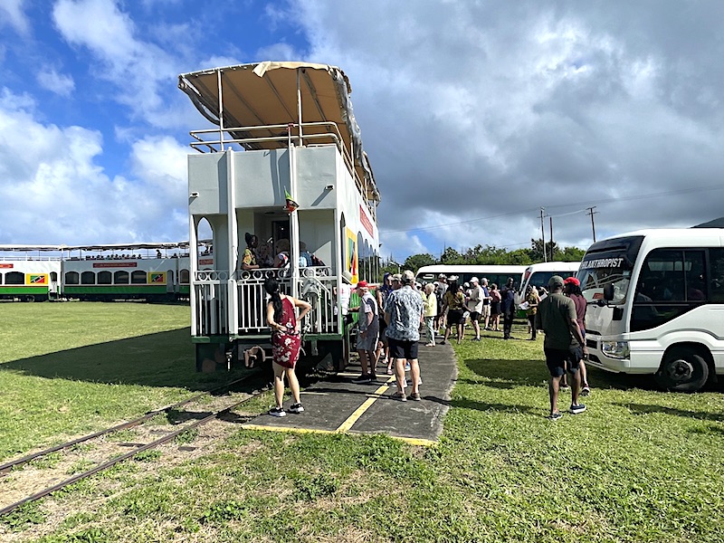Passengers unloading and entering the St. Kitts Scenic Railway at La Vallee Siding