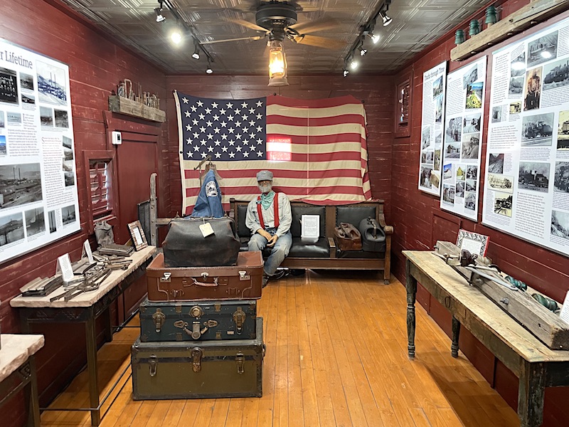 The interior of the box car Railroad Museum featuring items from the collection of John Bell